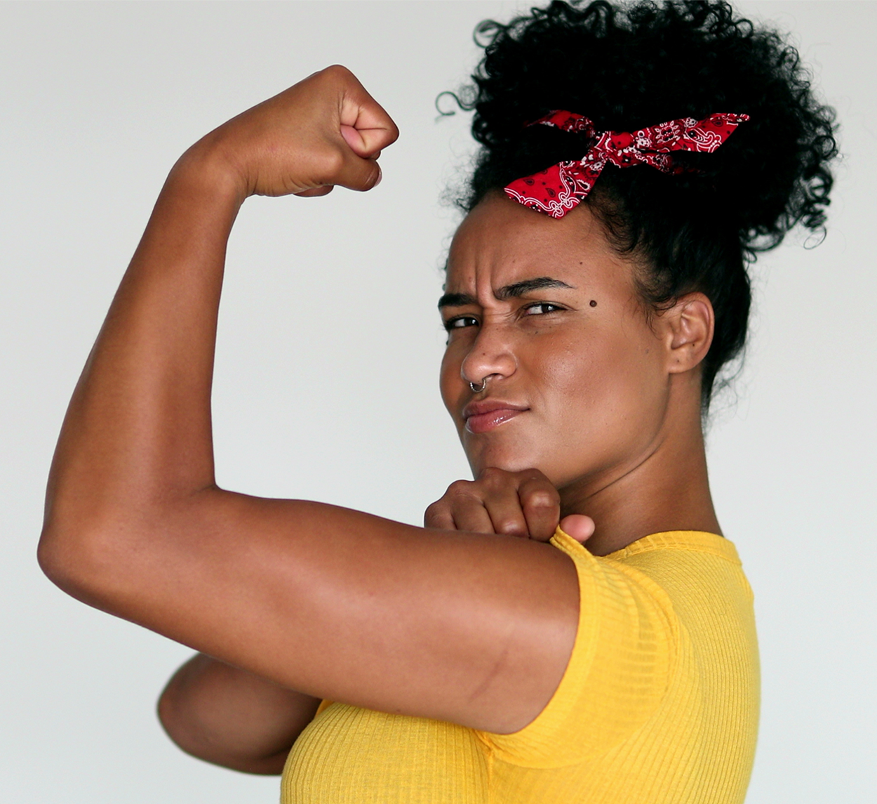 Image of a woman demonstrating flexion of the shoulder, elbow and wrist