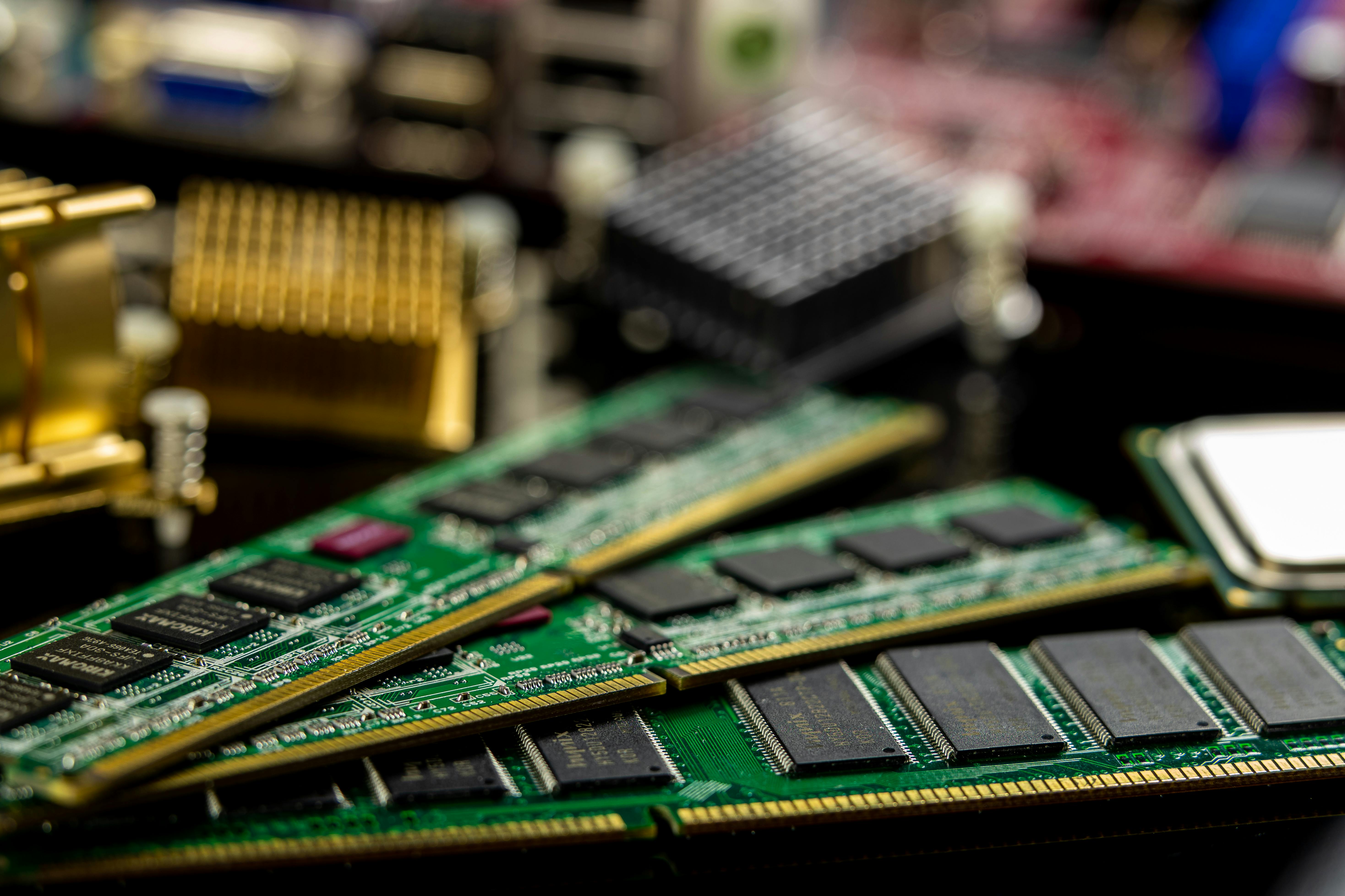 Rectangular-shaped RAM sticks or DIMMs with multiple chips on their surface. They also consist of several closely spaced pins engraved along their length on one of the longest sides.