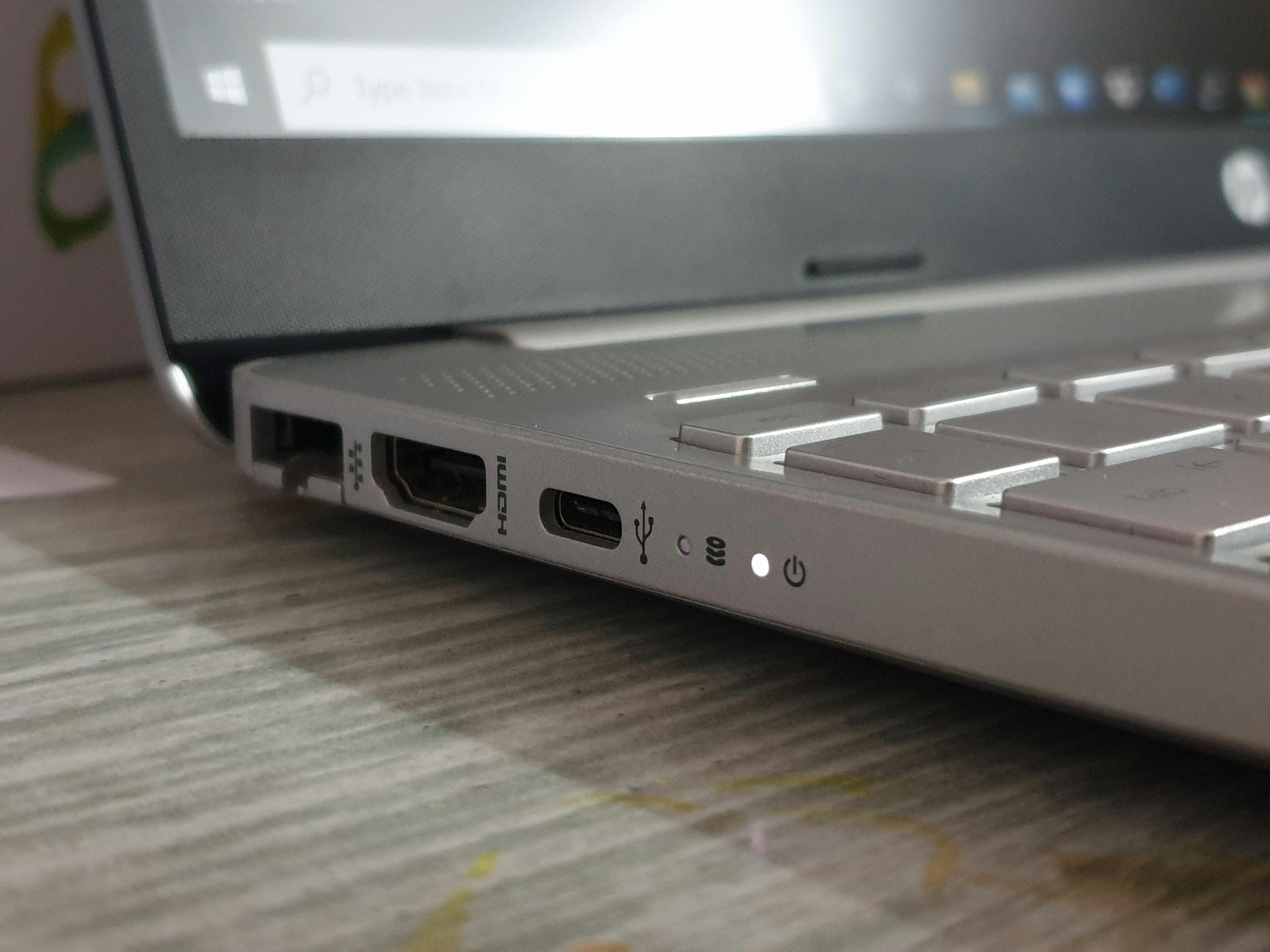 three ports on a laptop computer; the Ethernet port is large and square, the HDMI port is flat and trapezoidal, and the USB C port is small and pill-shaped
